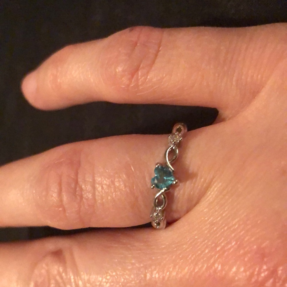 Described on purchase as Heart Shaped Blue Topaz Ring